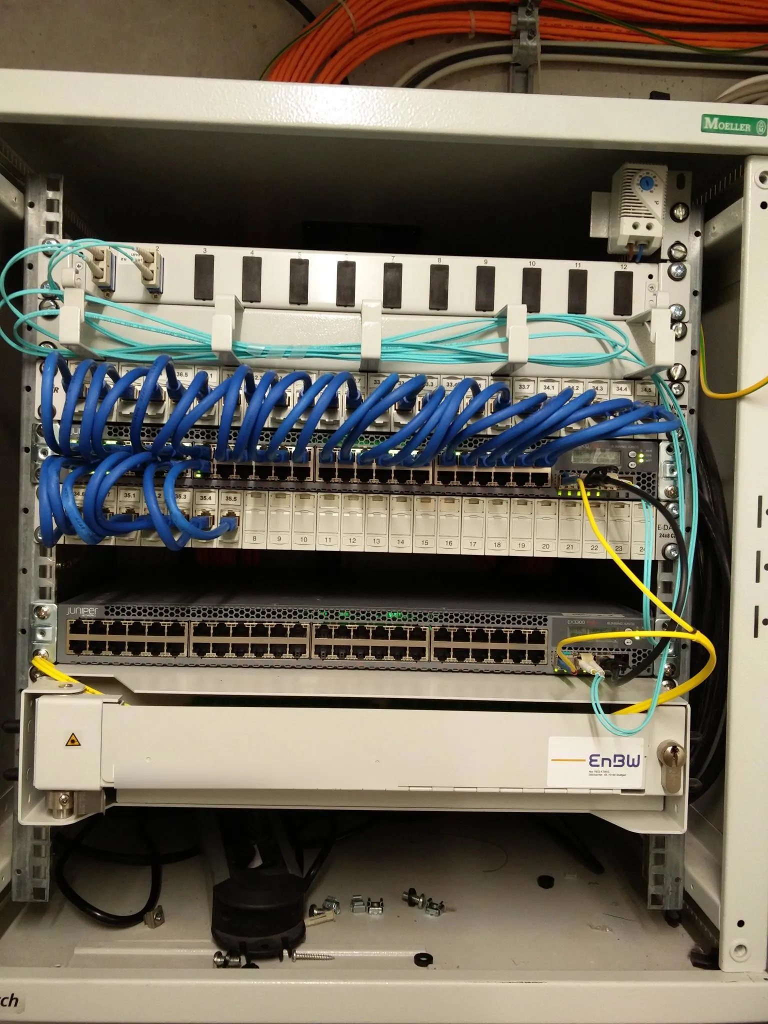 Switches in house A connecting the fiberoptic uplink from the outside the the rooms in house A and to the other switches in house B and C.